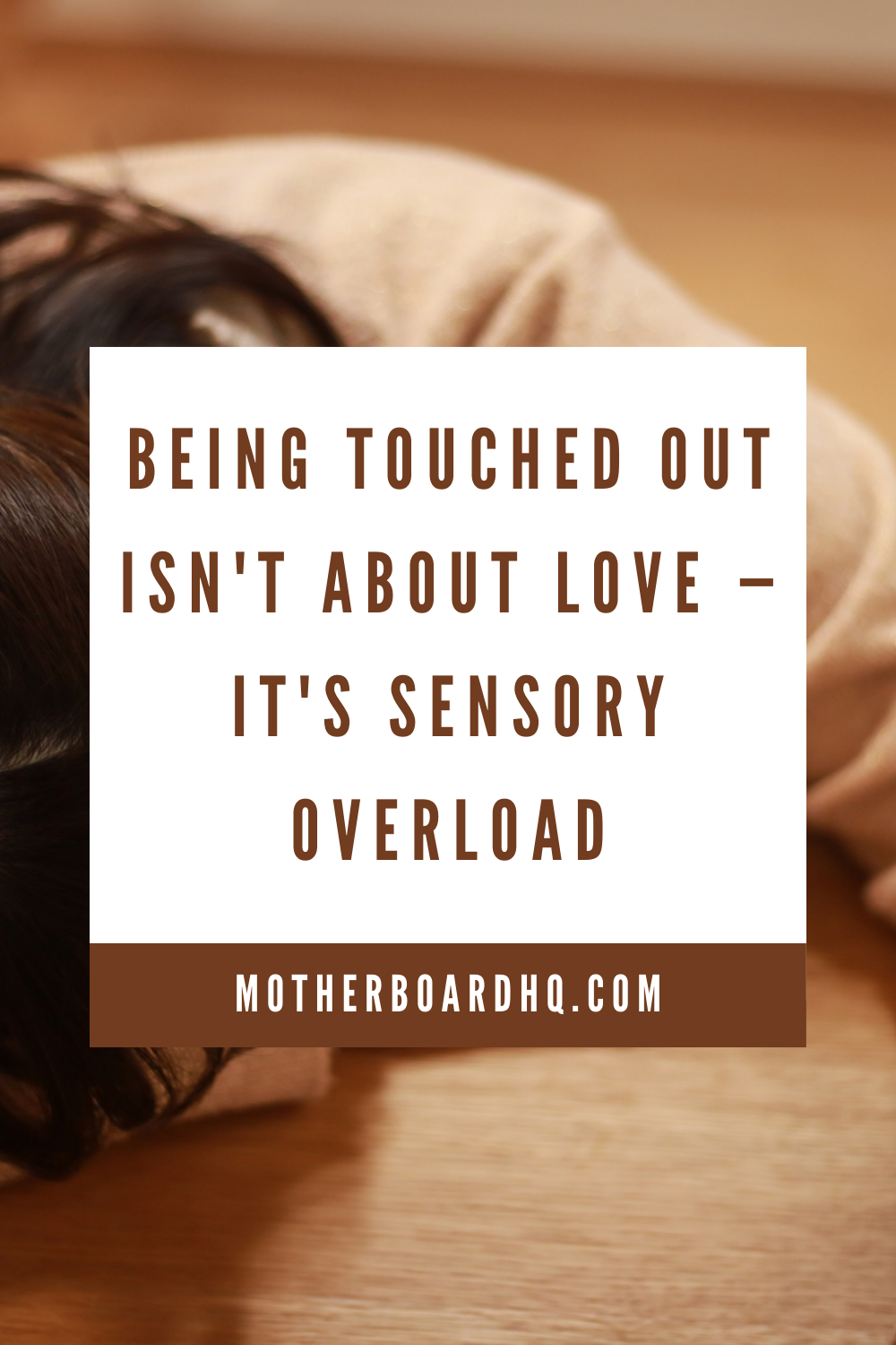 Exhausted mother lying on floor with baby - touched out and experiencing sensory overload from constant touch and stimulation