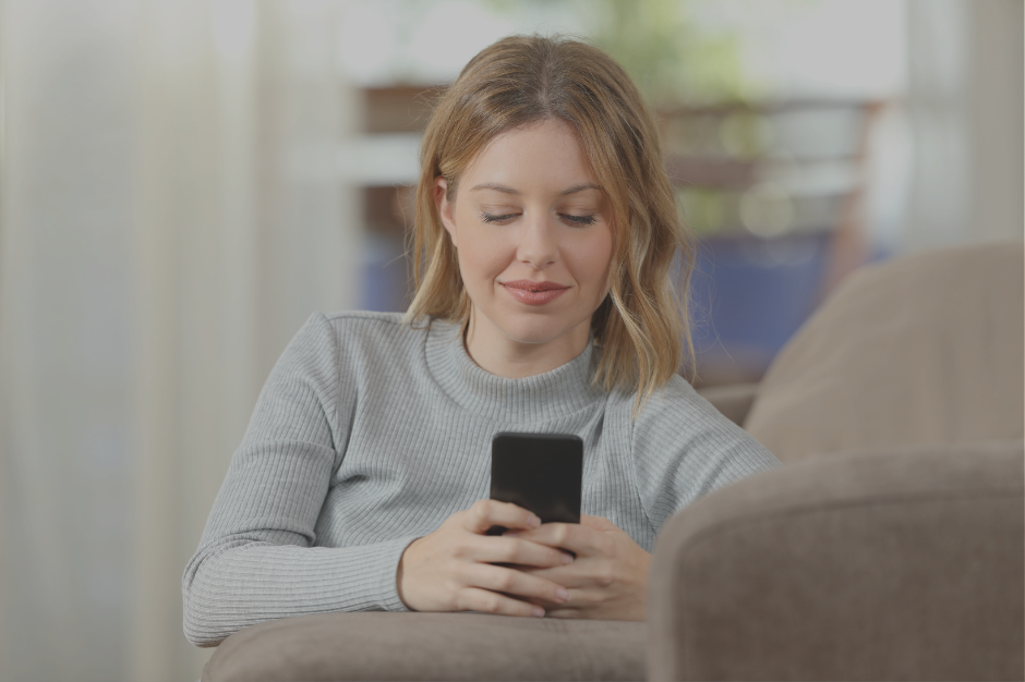 AuDHD mom texting communication script on phone while sitting on couch